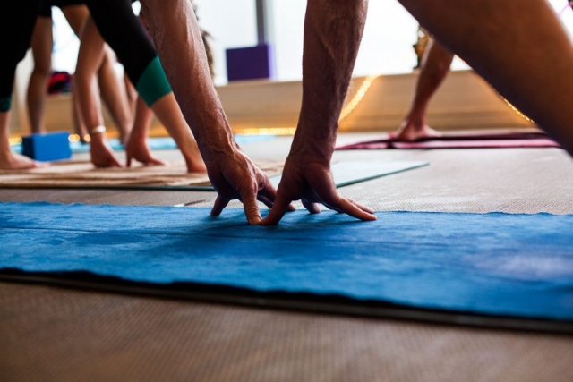 Hands Reaching on Yoga Mat